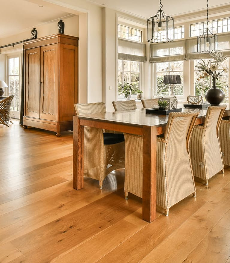 a large dining room with a large table and chairs