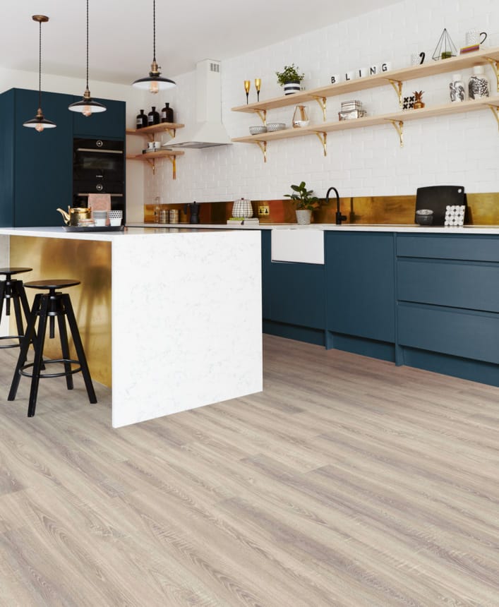 Blue white and gold kitchen with wood flooring